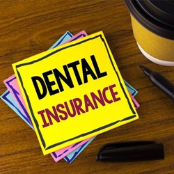 Dental insurance written on post it note