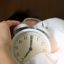 Alarm clock with man sleeping