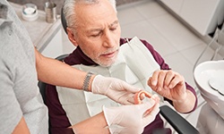 Man with dentures at the dentist