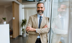 Man smiling in office building