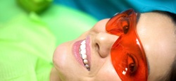 A woman smiling in the dentist chair