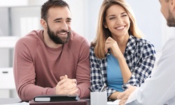 A couple discussing with the dentist