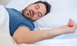 Snoring man, in need of effective sleep apnea treatment