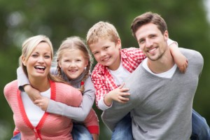 smiling family seeing family dentist